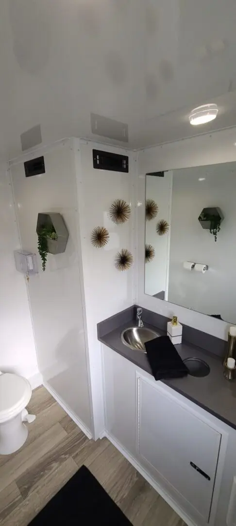 A bathroom with a huge mirror