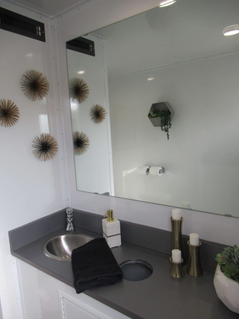 Bathroom with two sinks and a large mirror